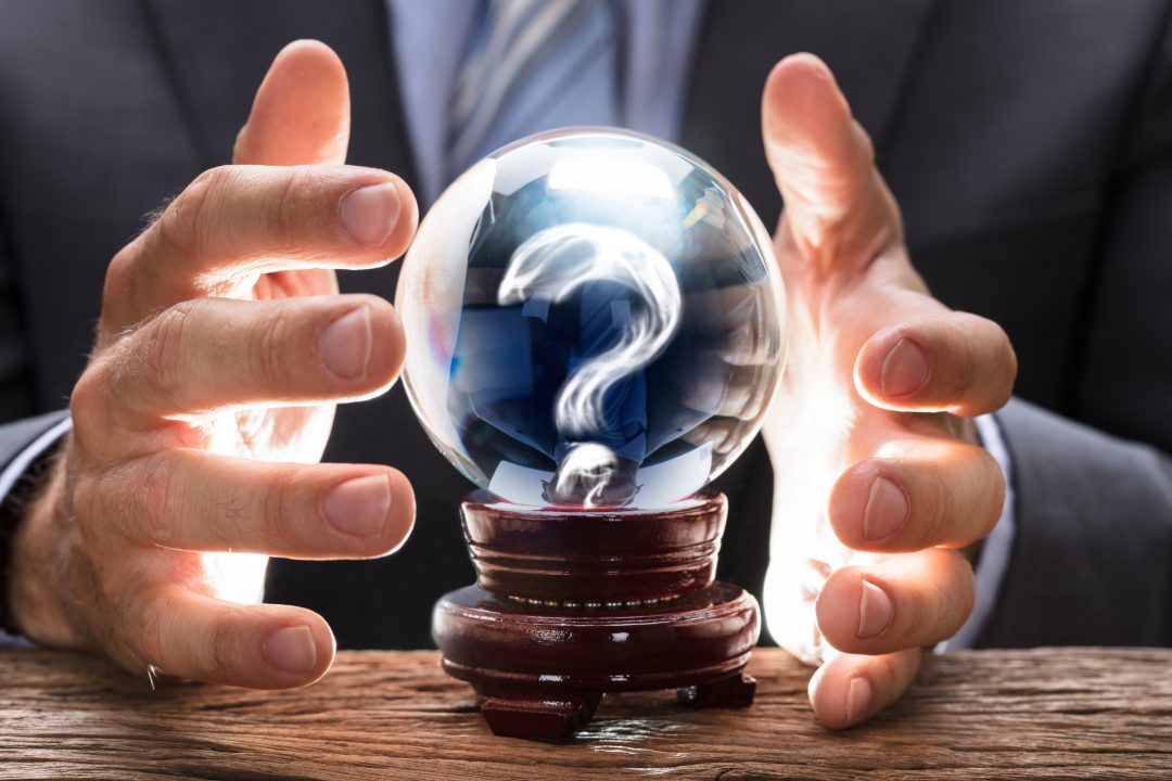 Businessman Covering Crystal Ball With Question Mark Psychic Chakra Spa